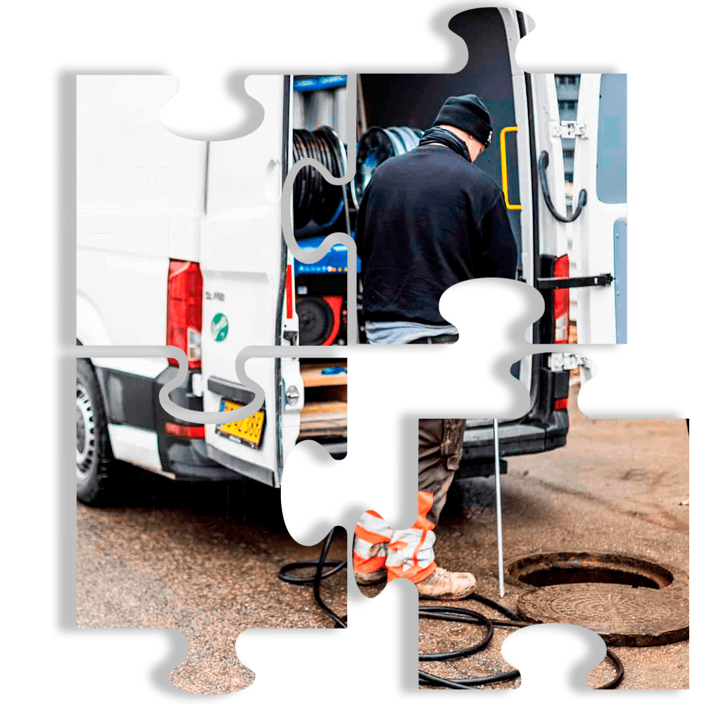 Medarbejder ved bagenden af servicevogn klar til reparation af kloak